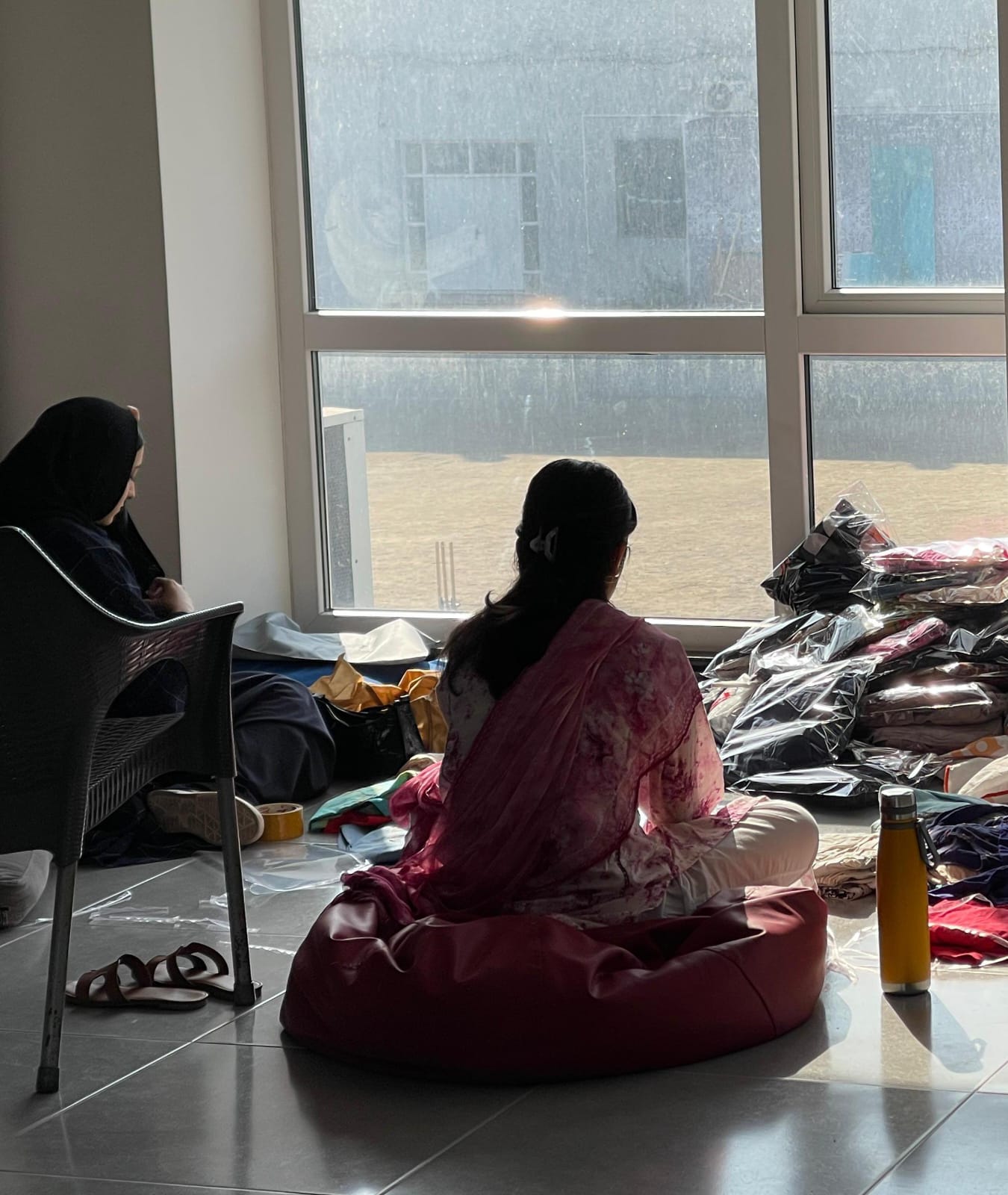 Volunteers organizing donated clothes for distribution