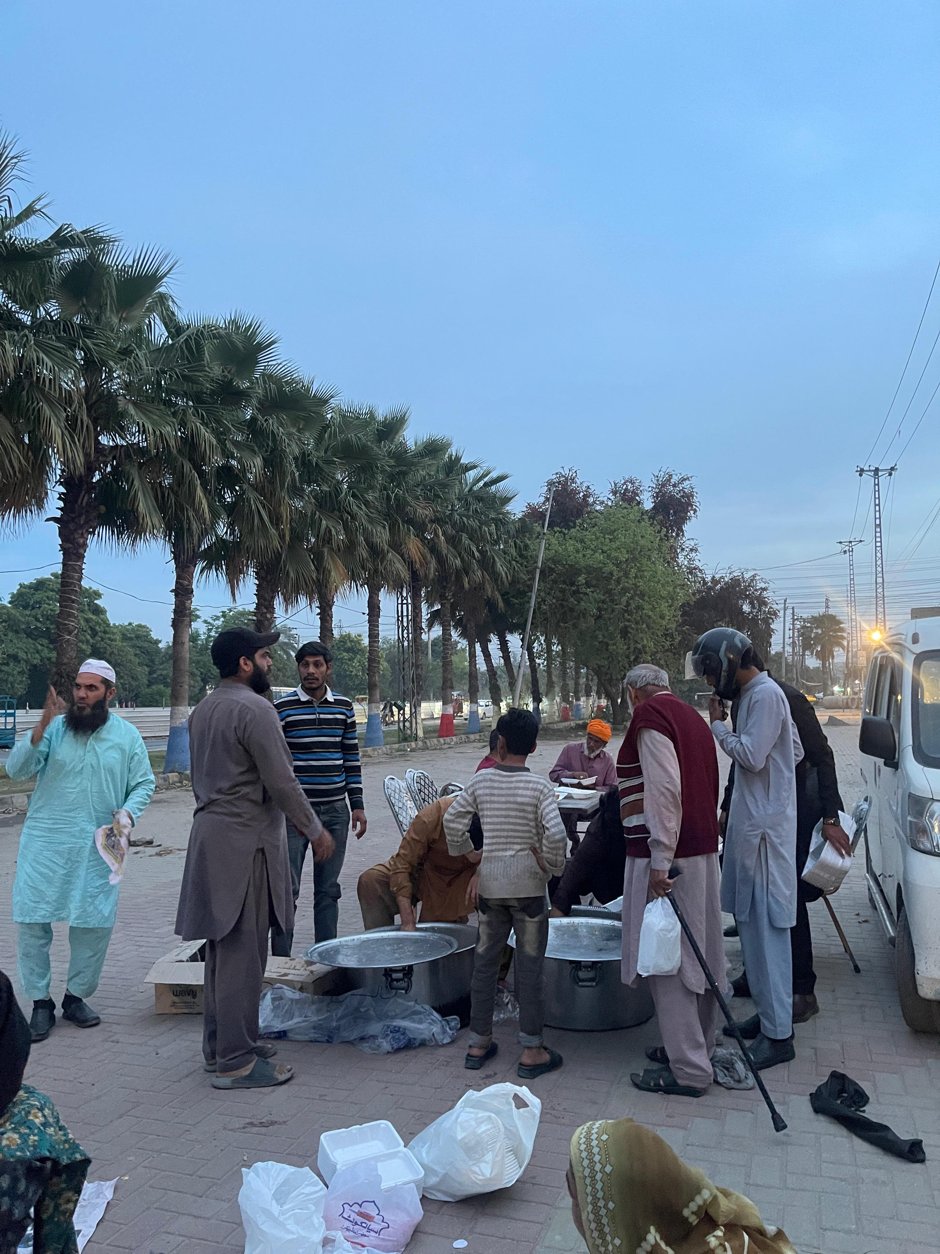 Volunteers distributing freshly prepared food in the community